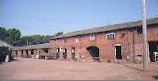 Back range of buildings at Tixall Farm before conversion